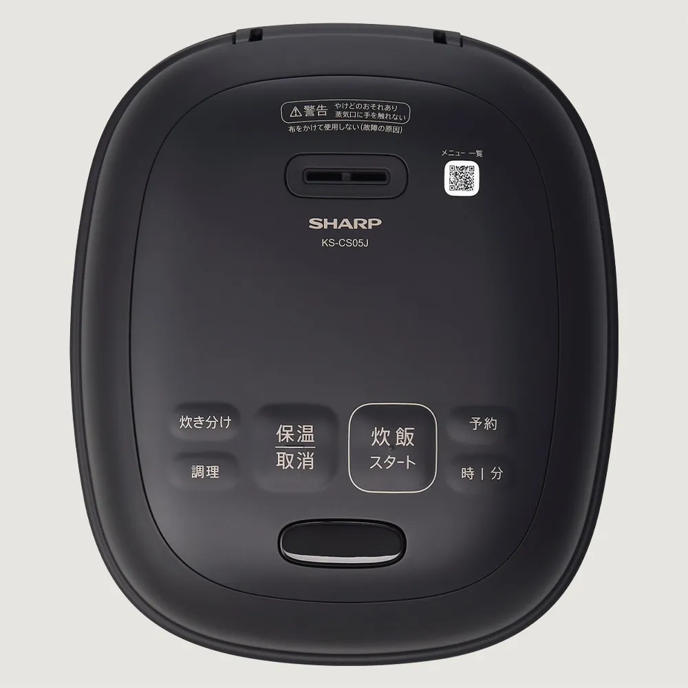 操作部とオープンボタンがある本体天面のイメージ。